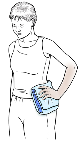 Woman holding ice pack on hip.